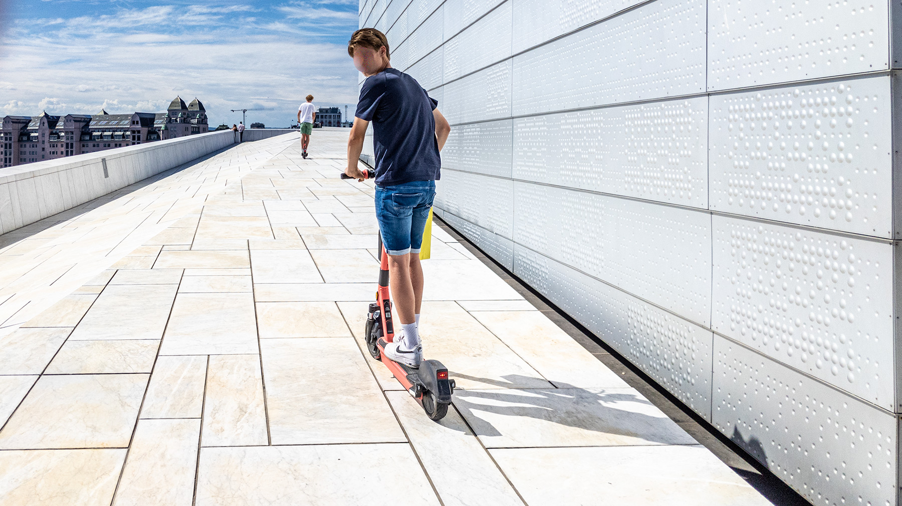 E Scooters riding on top of Oslo Opera House, June 2021.